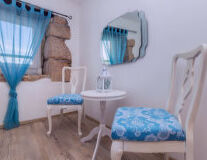 a bedroom with a blue chair